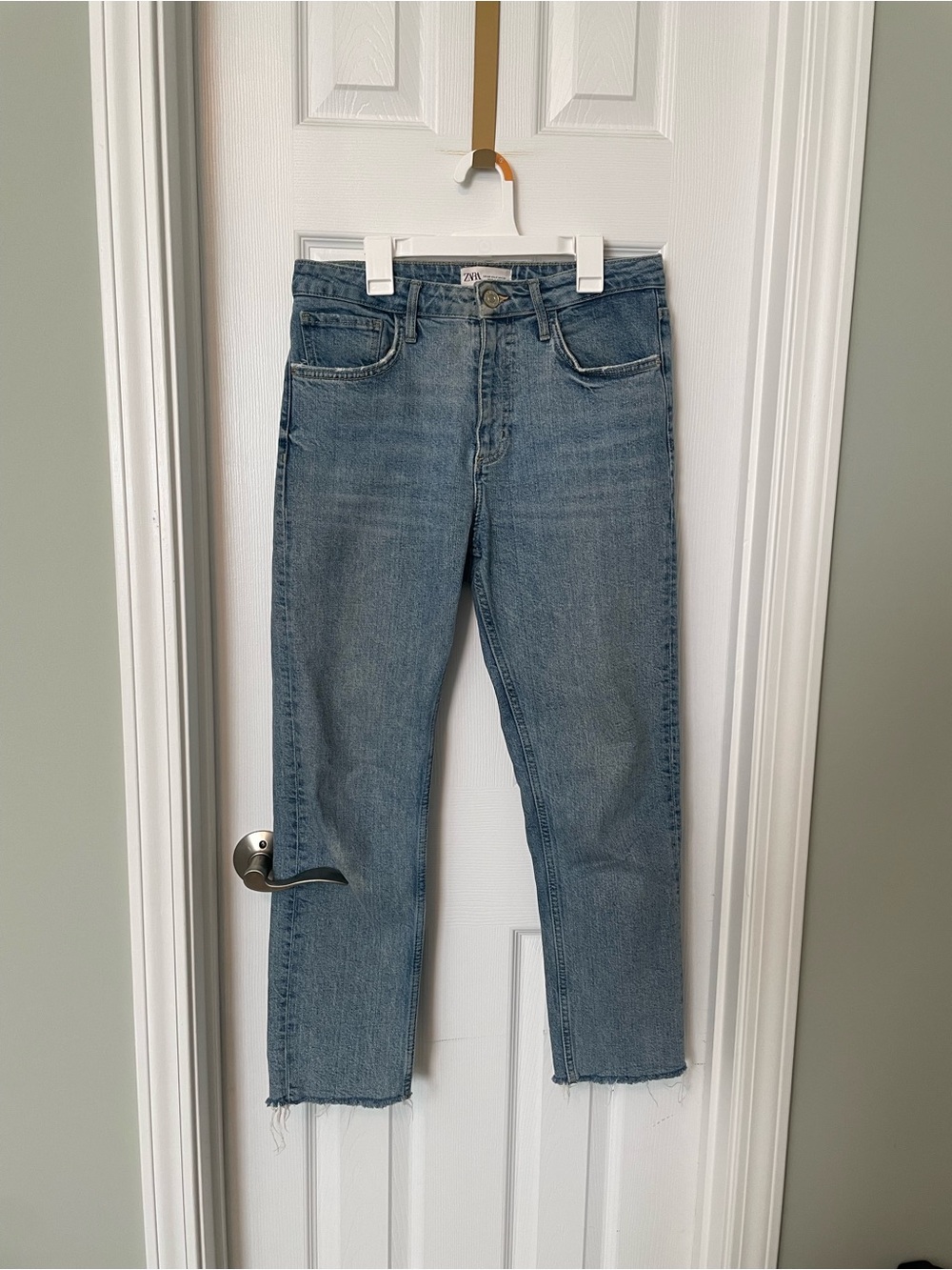 Zara high rise, straight-leg jeans with a casual raw frayed hem.